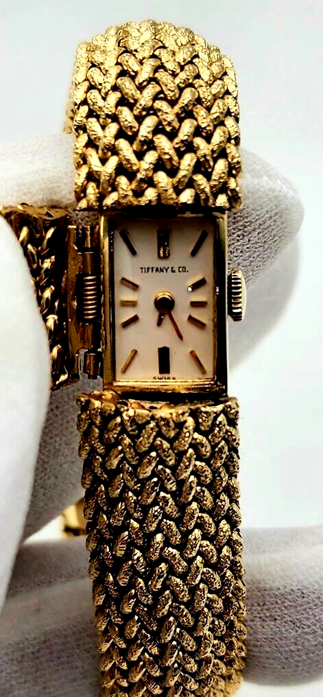 Tiffany & Co. 14K Gold Watch built into a gold bracelet (Covered Face Bracelet )